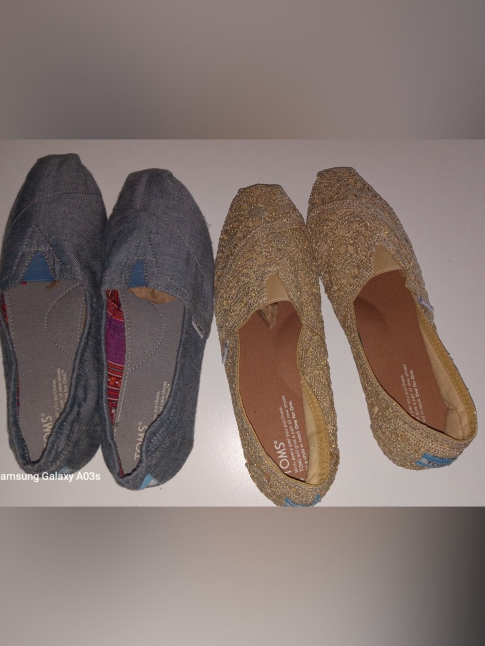 Two pairs of Tom’s shoes
